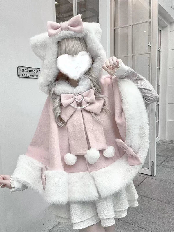 Pink hooded cape with cat ears, bow, white trim and pom-poms
