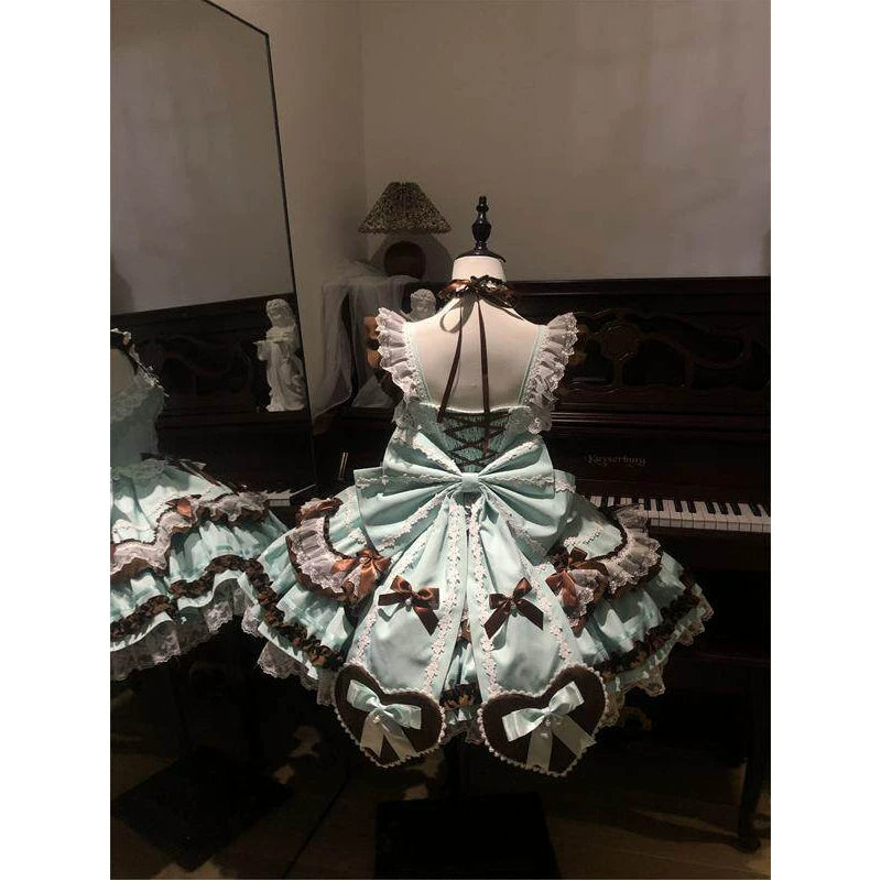 Creamy mint-and-chocolate JSK dress set with layered ruffles, lace trim and brown bows on a mannequin