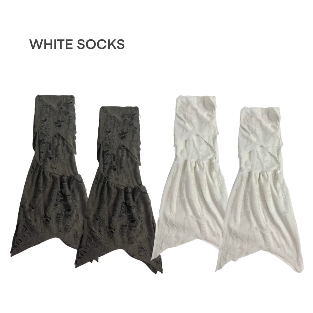 White deconstructed broken wasteland sock sleeves with distressed cutouts and flared silhouette