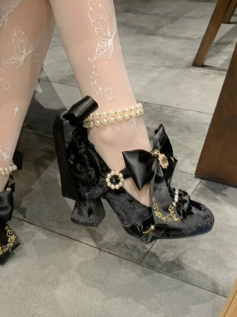 Aimee Ribbon Hymn Lolita shoes — black heel and bow detail worn on the foot