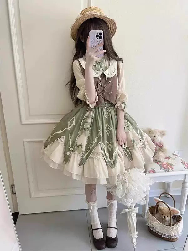 Cream blouse, brown vest and muted green short Lolita skirt set shown in a mirror.