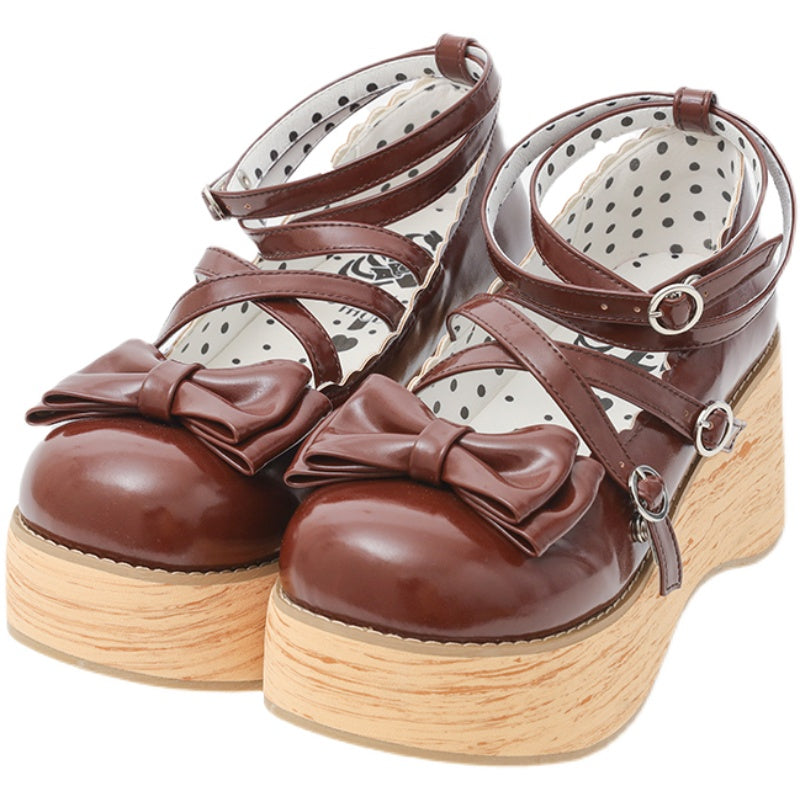 Brown Sweet Lolita platform shoes with large bows, cross straps and wood-look soles