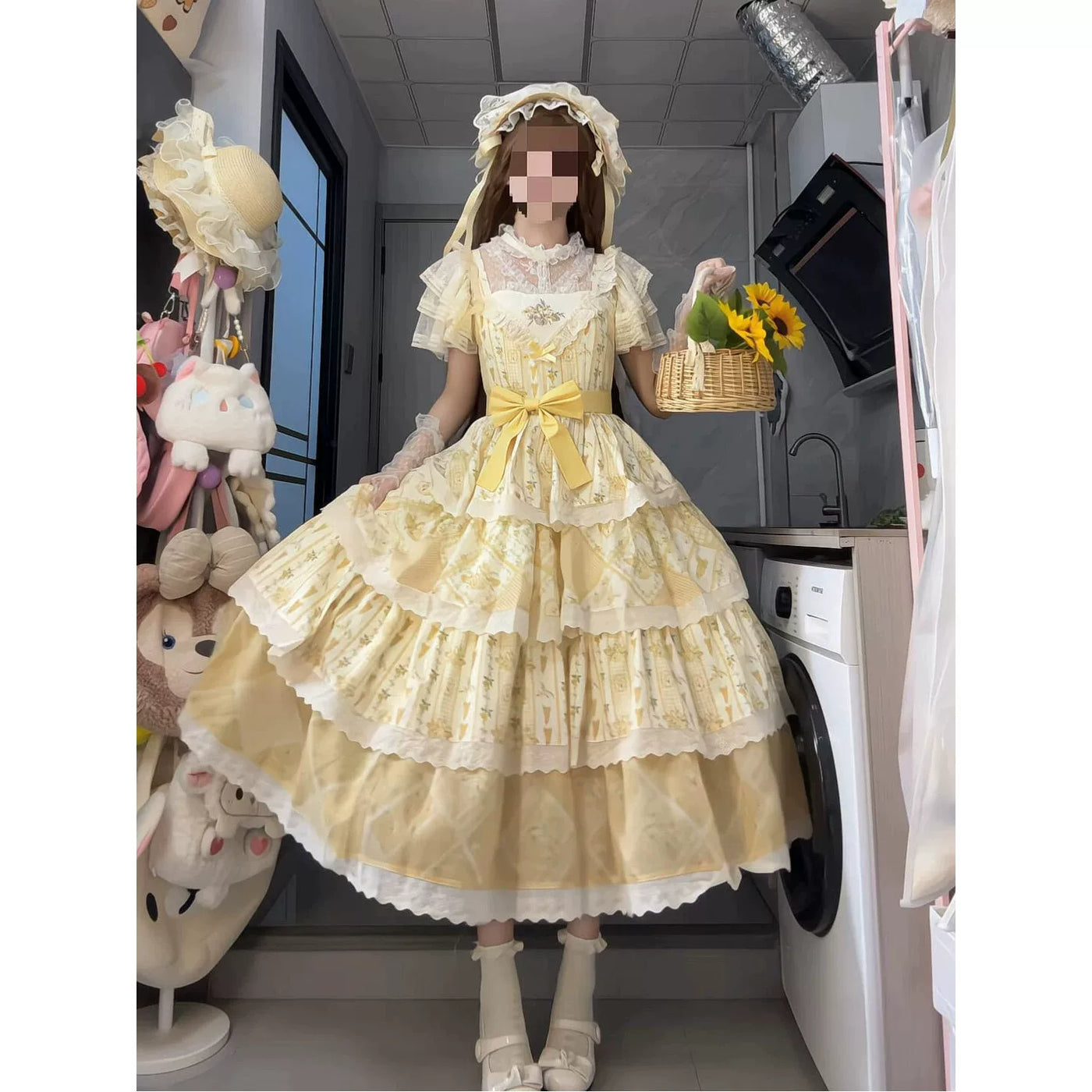 Styled yellow embroidered JSK dress with a waist bow and layered skirt.