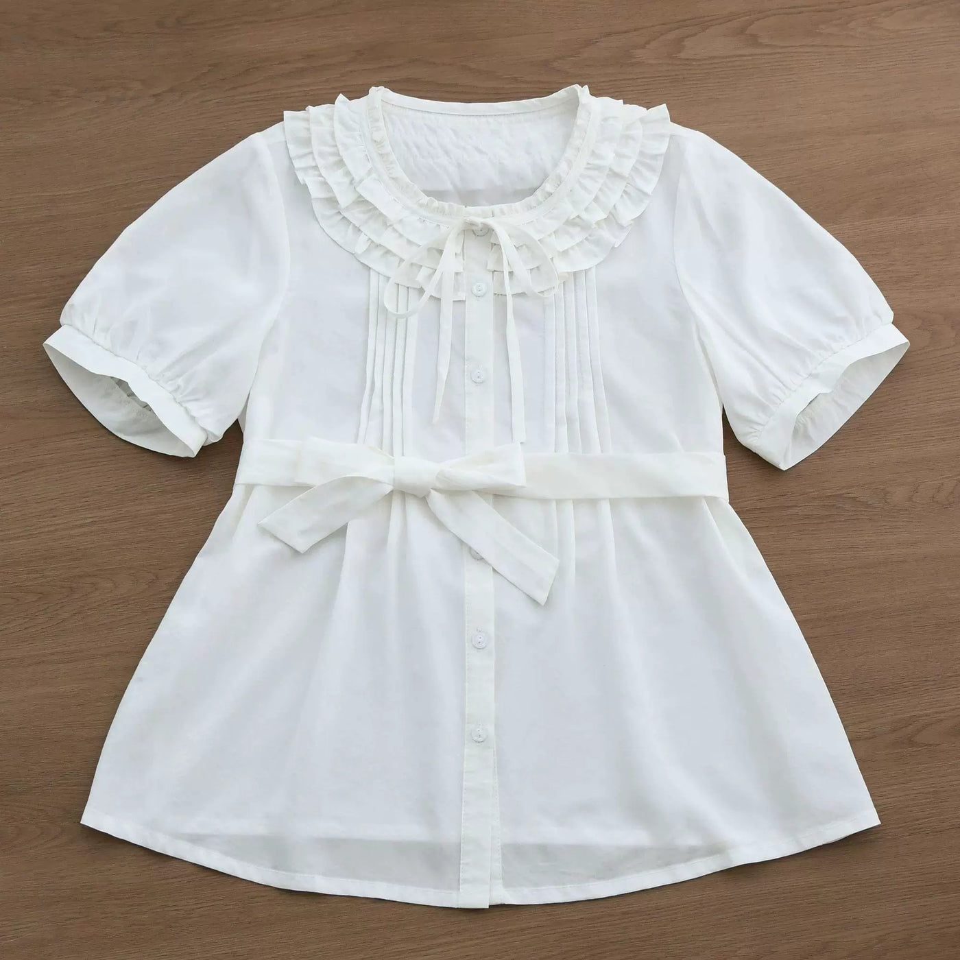 Sweetheart Dream Machine milk-white and light-pink short-sleeve blouse with ruffled collar.