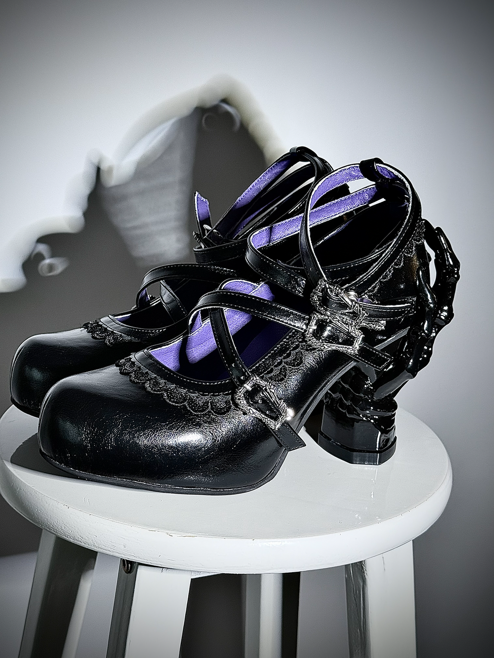 Black Gothic Lolita heels with cross straps, scalloped trim and sculpted hand-shaped heels
