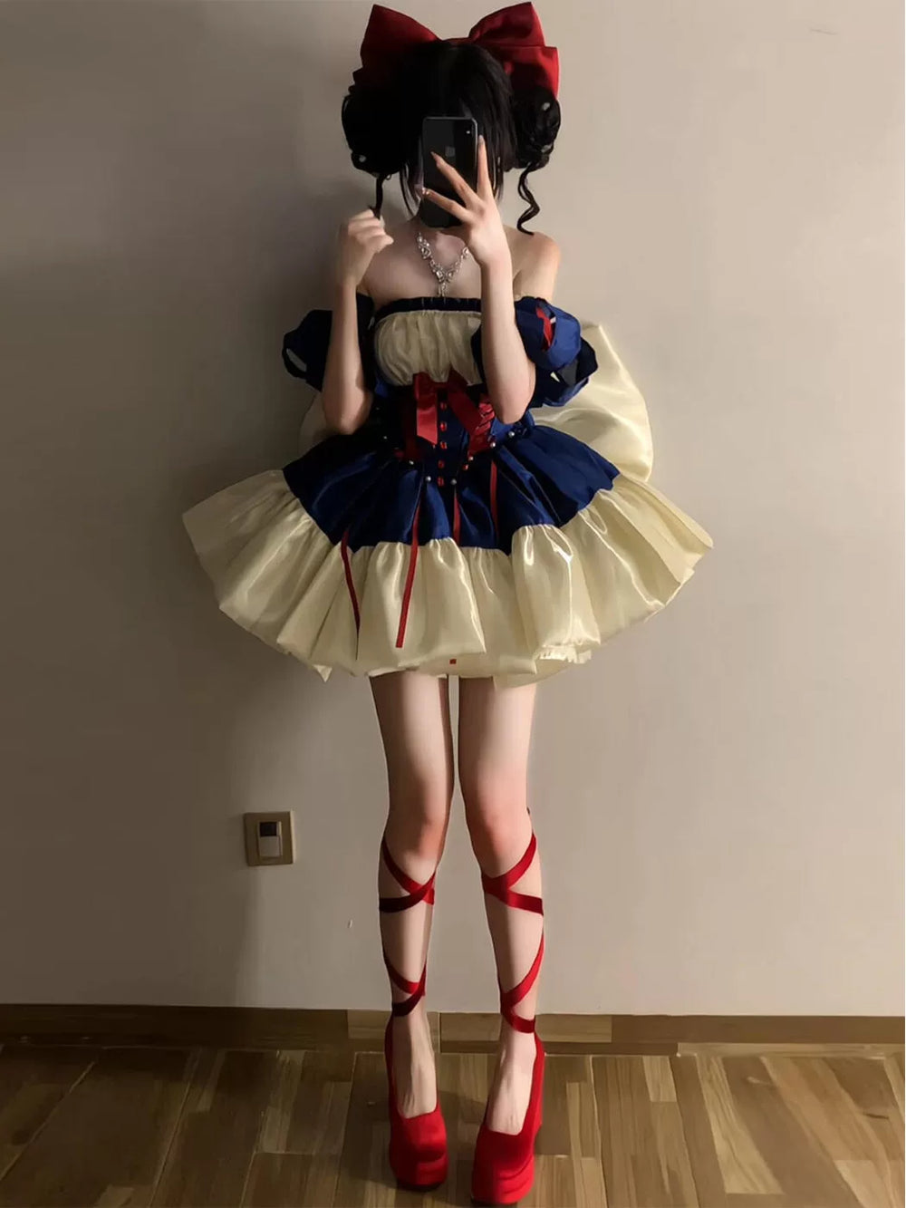 Creamy navy and ivory princess OP dress with red bow accents, puff sleeves and layered ruffles.