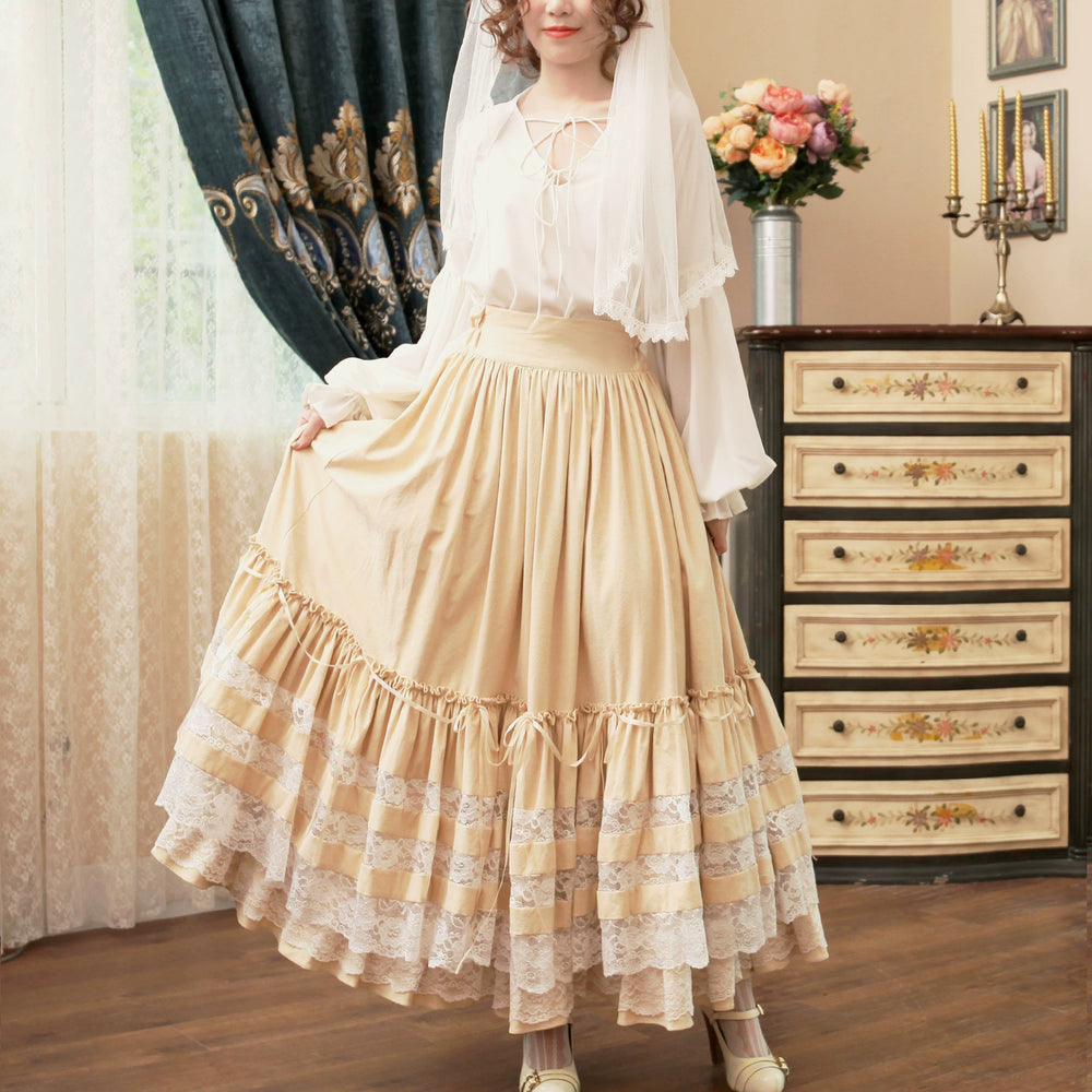Apricot multi-layer lace skirt styled with a white blouse in a Lolita coordinate.
