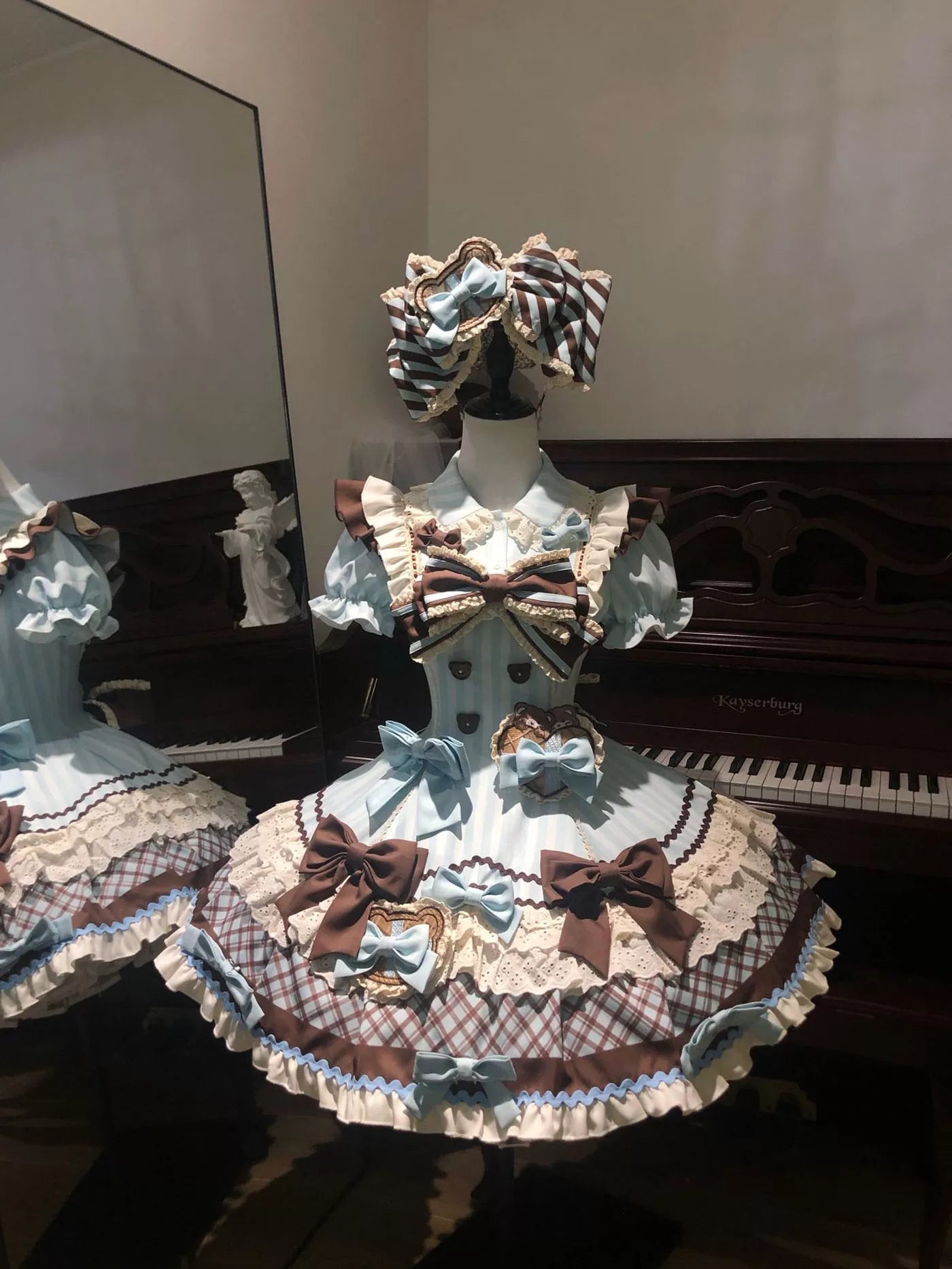 Sweet Lolita one-piece dress with horizontal striped bodice, puffed short sleeves, and tiered bell skirt in pastel blue and brown