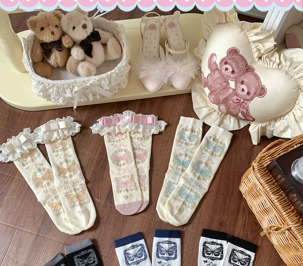 Butterfly-print short socks arranged in pastel, navy, black, white and gray colourways with lace trim options.