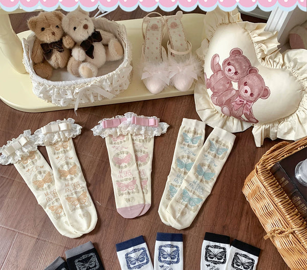 Butterfly-print short socks arranged in pastel, navy, black, white and gray colourways with lace trim options.