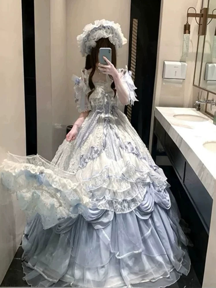 Light blue Lolita dress with lace bodice detailing and puffed sleeves on a model