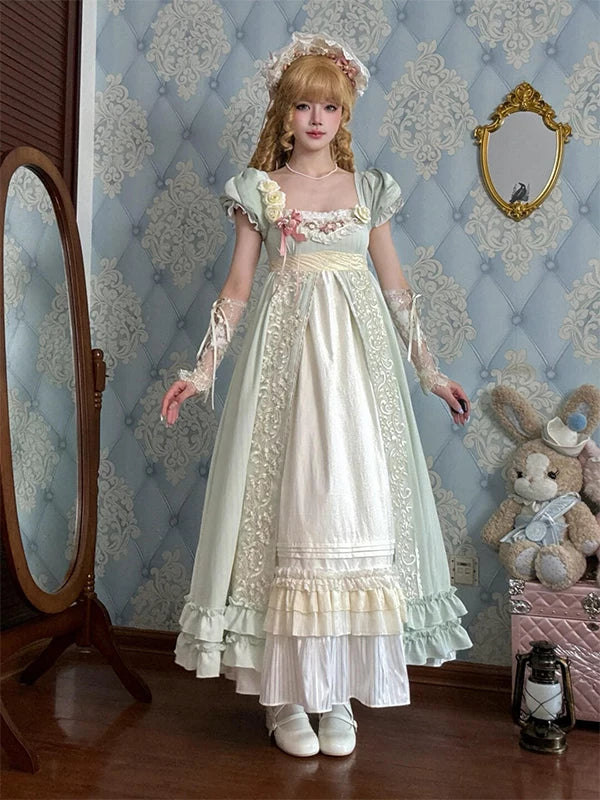 Green Lolita dress with puff sleeves, floral bodice accents and a layered ruffled hem.
