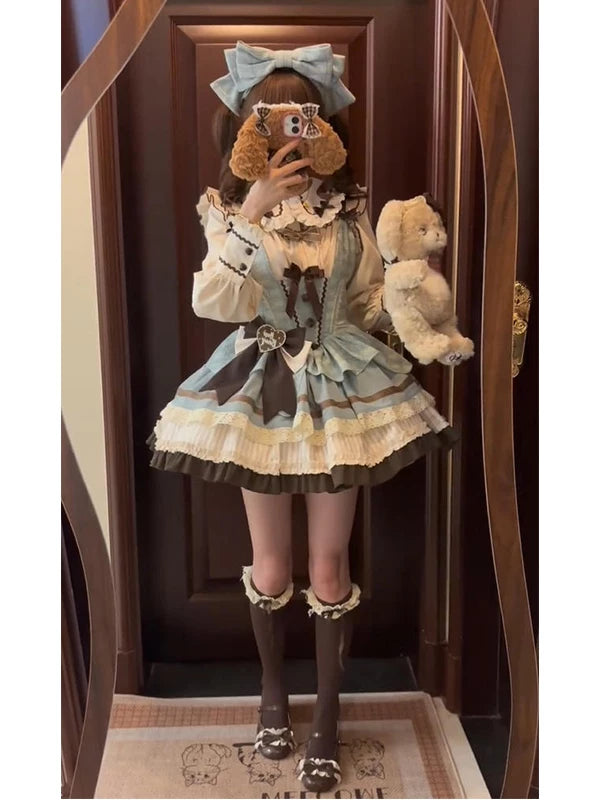 Mirror photo showing a blue and brown Mint Chocolate JSK outfit with lace trims and a large bow.