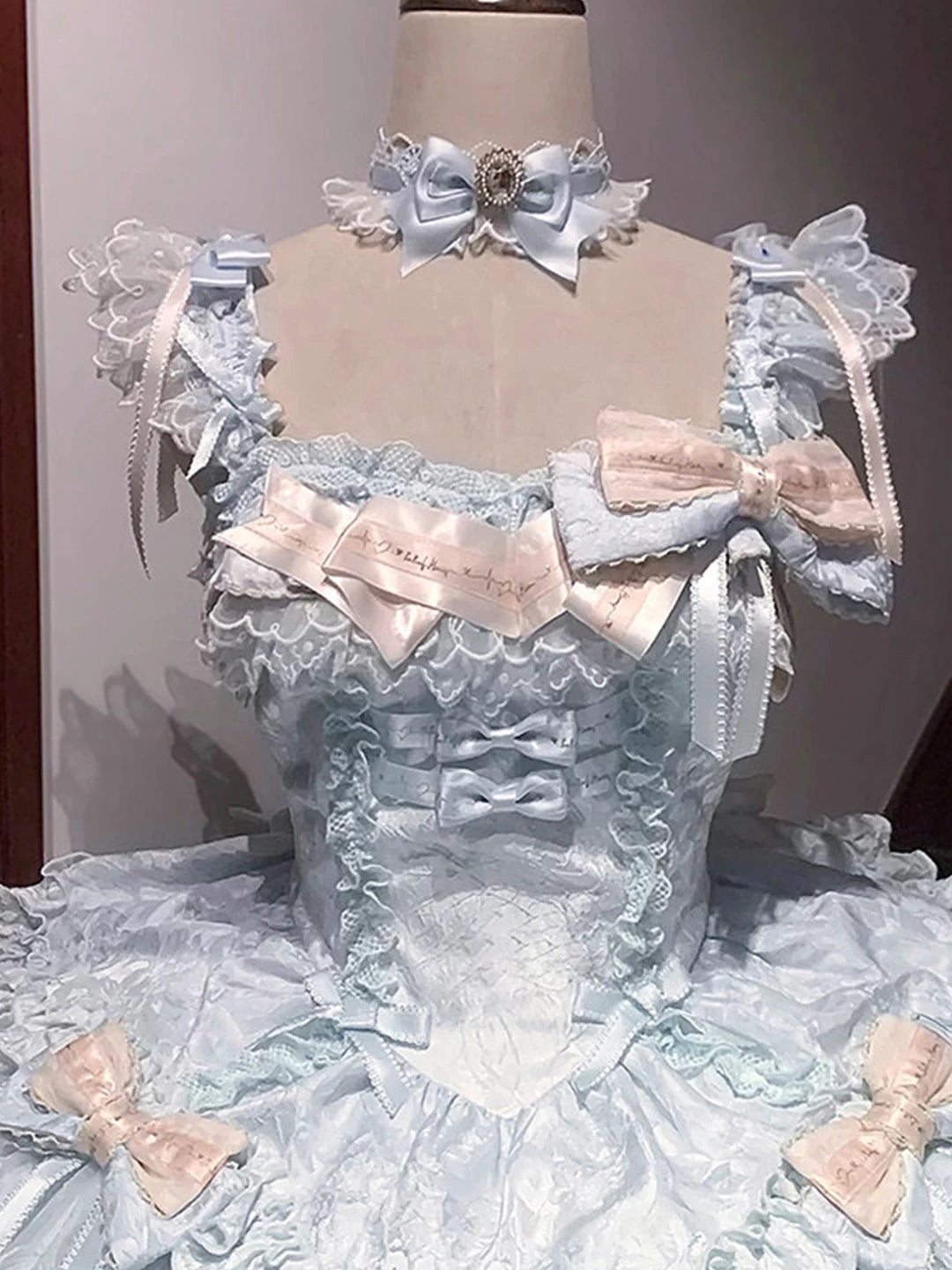 Blue and pale pink ruffled JSK dress displayed on a mannequin.