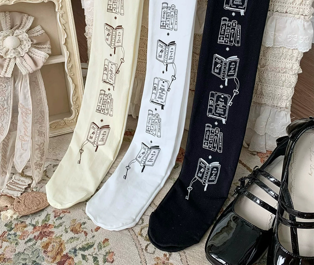 White, natural and black tights with repeating book and rabbit prints