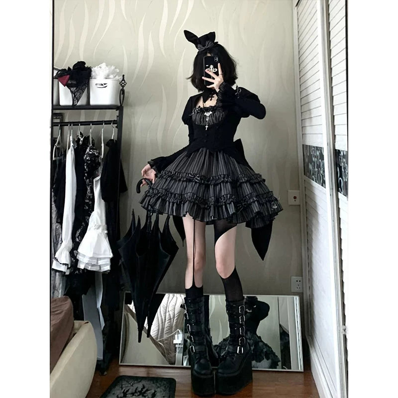 Black Gothic stripe one-piece dress with long sleeves and a pleated tiered skirt