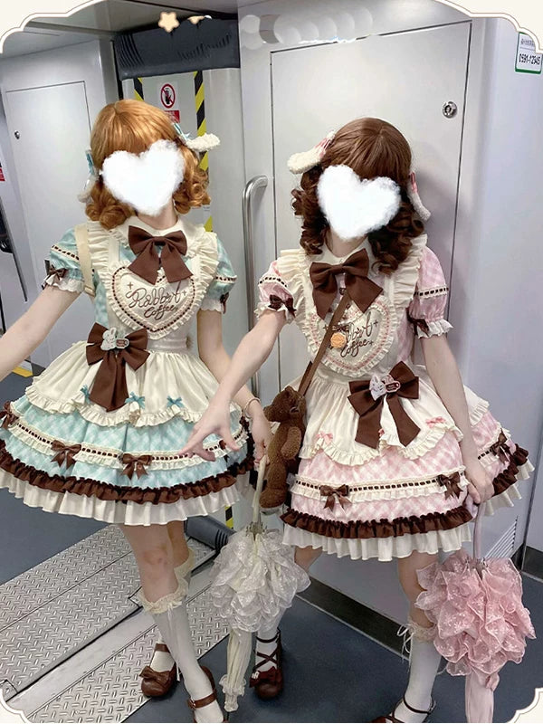 Mint and pink maid-style OP dress sets with coordinating aprons and contrast bows shown on models.