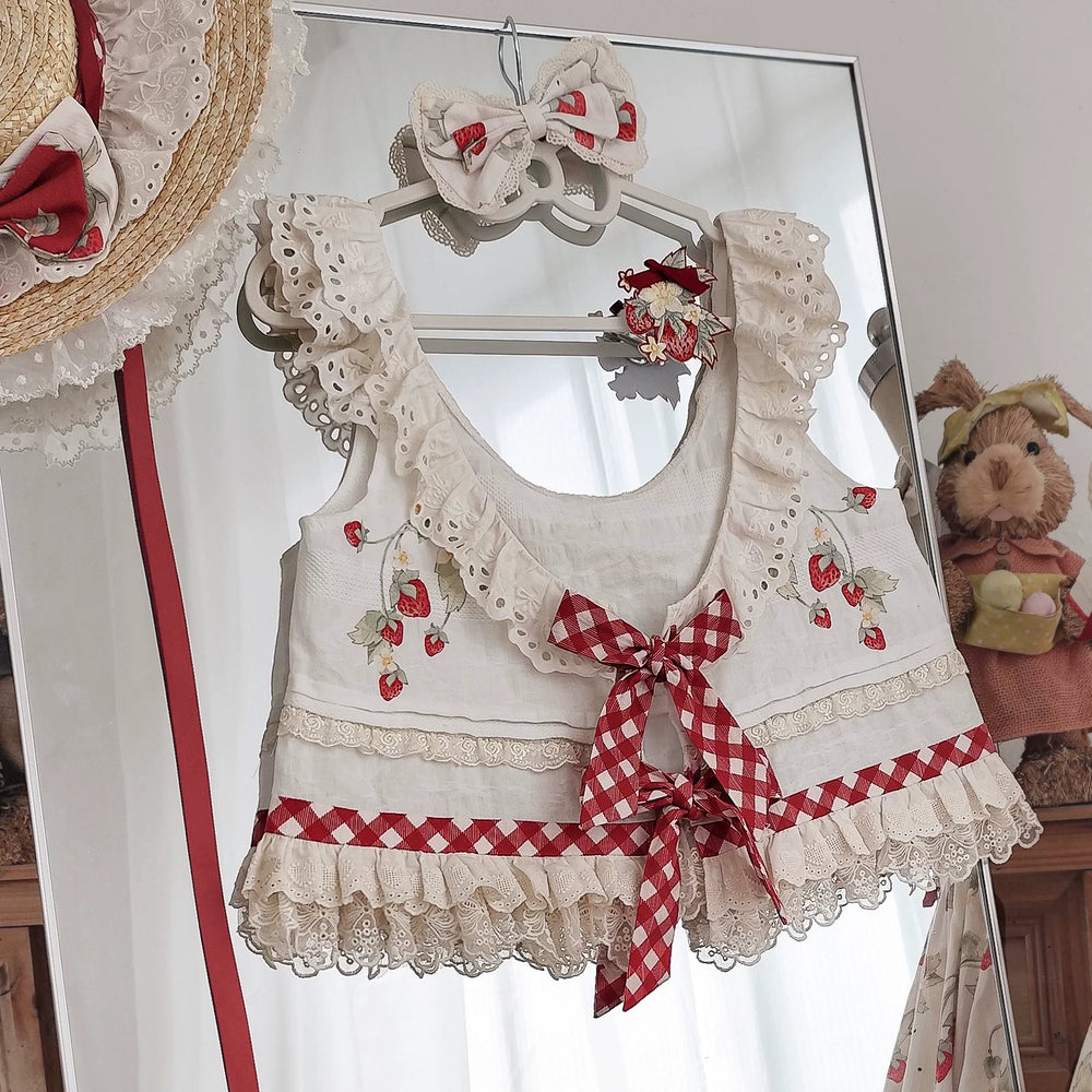 Strawberry Orchard cream vest top with lace trim and red gingham bows