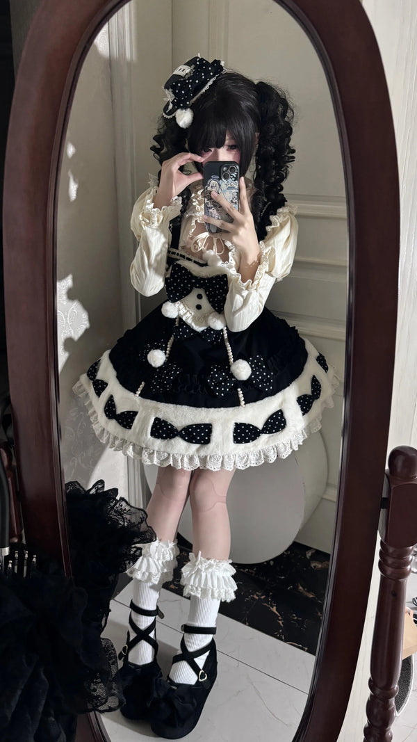 Black Snow Cake mini hat shown worn with the matching black JSK