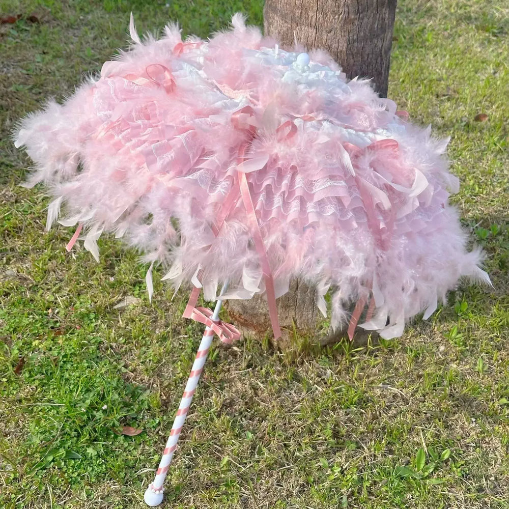 Pink feather-trimmed handmade Lolita umbrella with layered lace and ribbon details