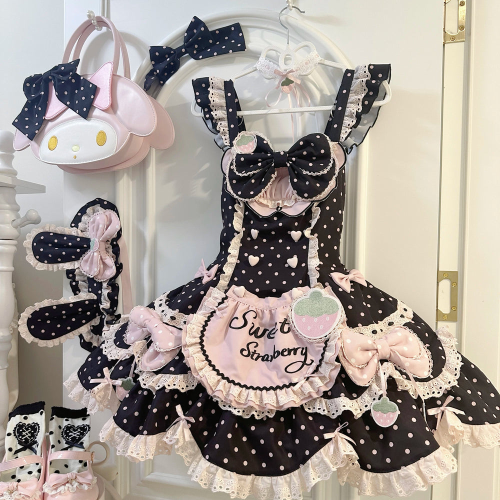 Black-pink strawberry polka-dot JSK with layered lace and bow details on a hanger