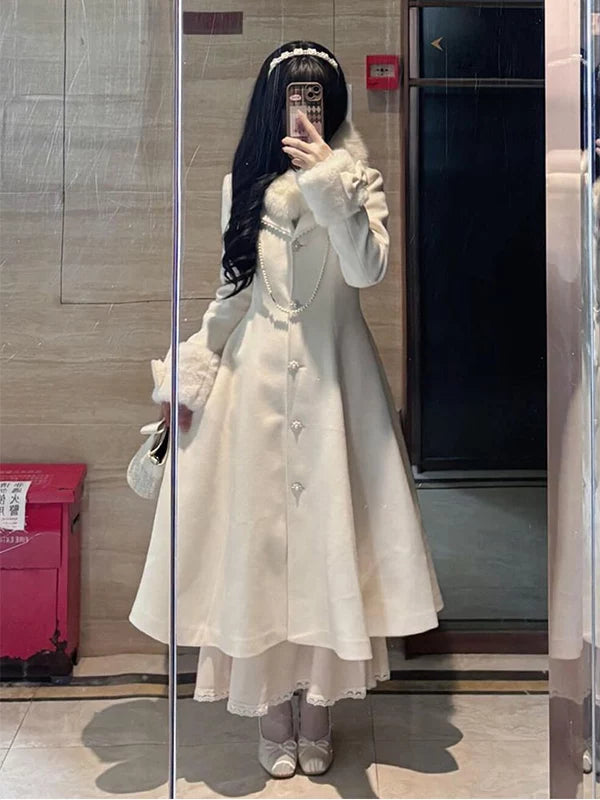 White double-breasted wool coat with shaped waist and flared silhouette