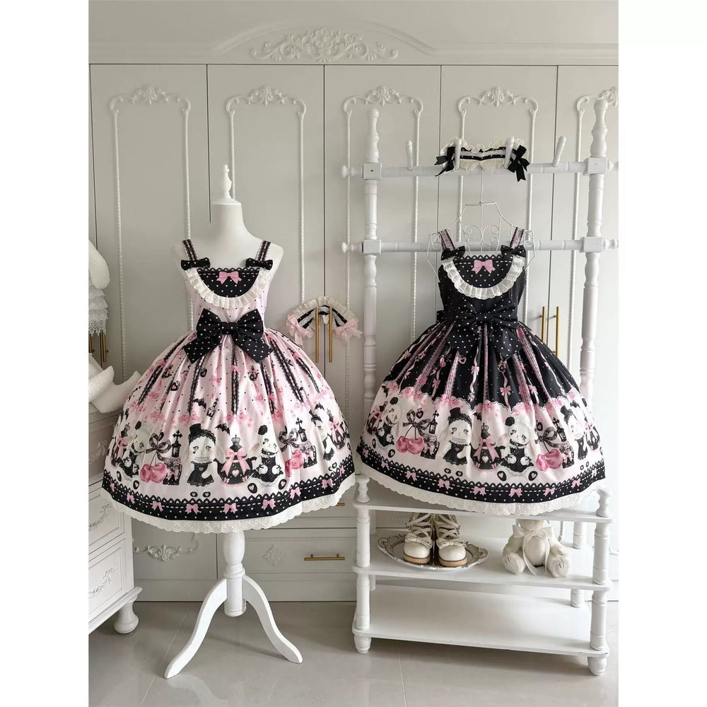 Pink and black heart-print JSK dresses with bows displayed on mannequins.