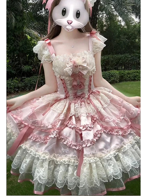 Pink ruffled JSK suspender dress with lace tiers, train, and matching hairband