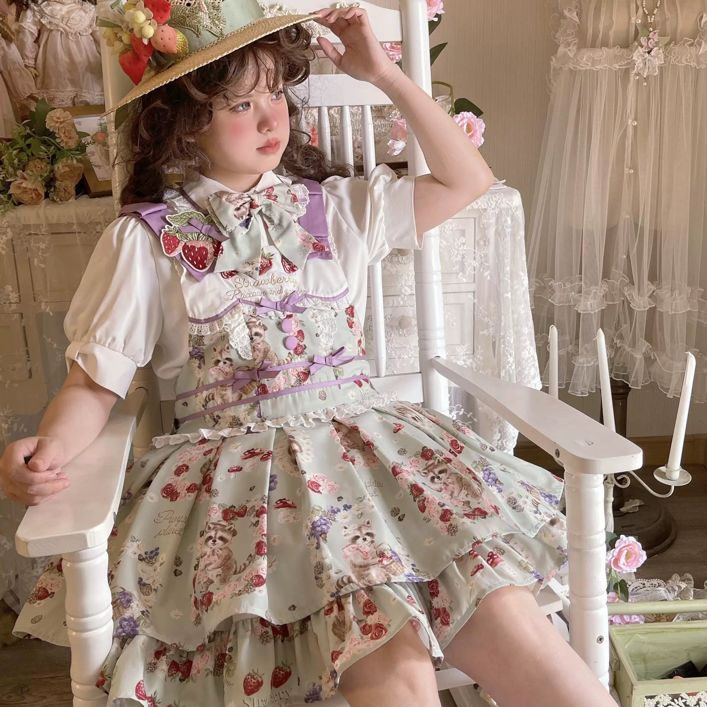 Yellow suspender JSK with strawberry embroidery, raccoon print, and tiered ruffled skirt