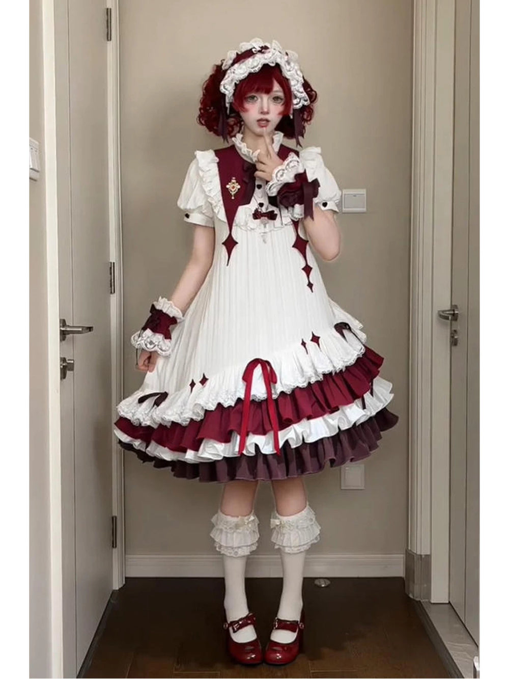 Creamy white and burgundy OP dress with layered ruffles and bow details