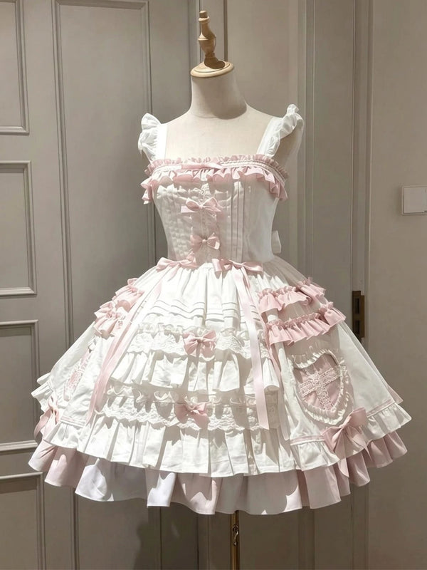 Pink-and-white JSK dress with layered ruffles and a matching cape displayed on a mannequin.