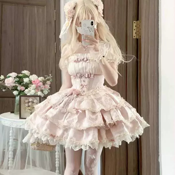 Doll-style lolita dress with bow embellishments on ruffled tiers and scalloped lace hem