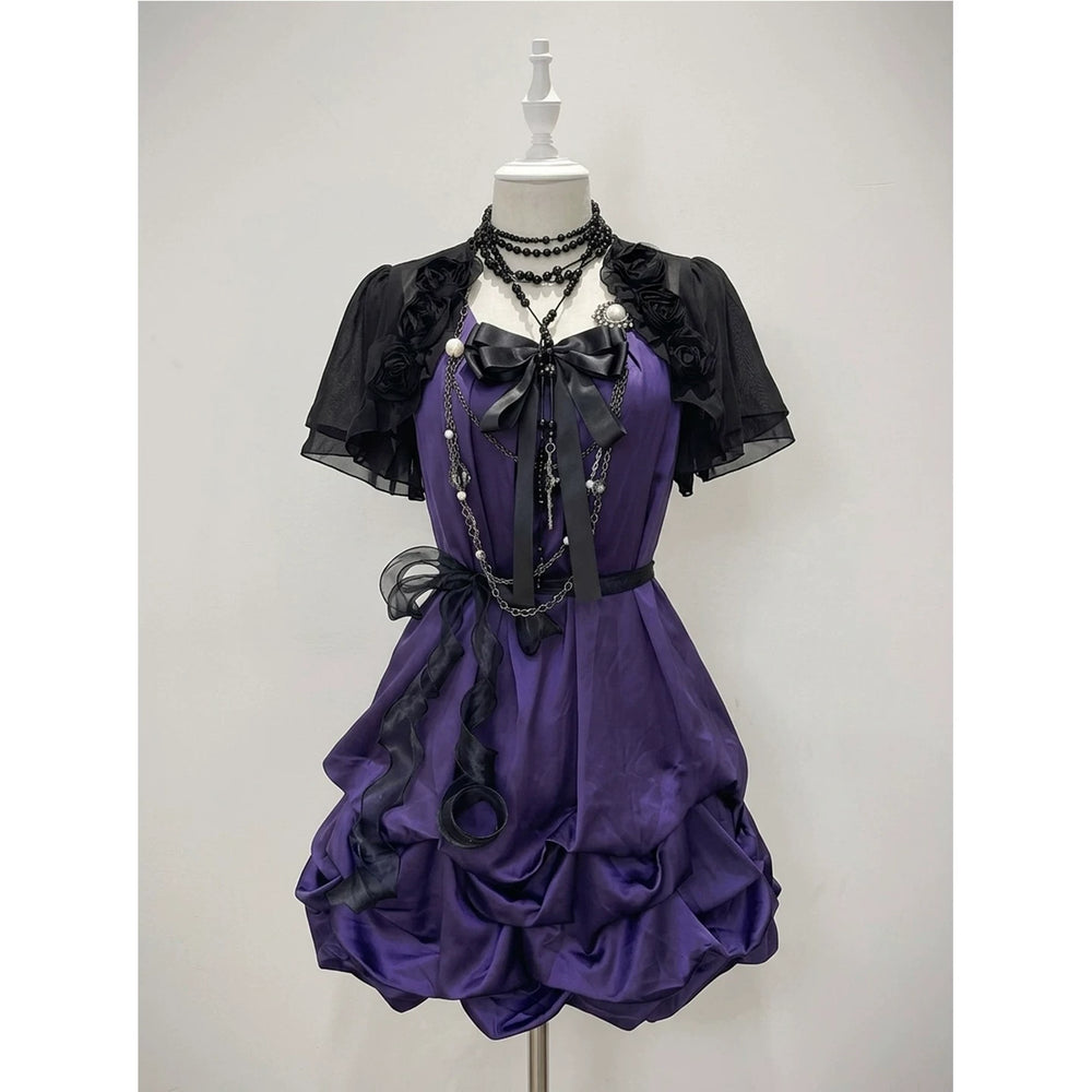 Styled image of a purple OP with a black rose cardigan and layered ruffles.