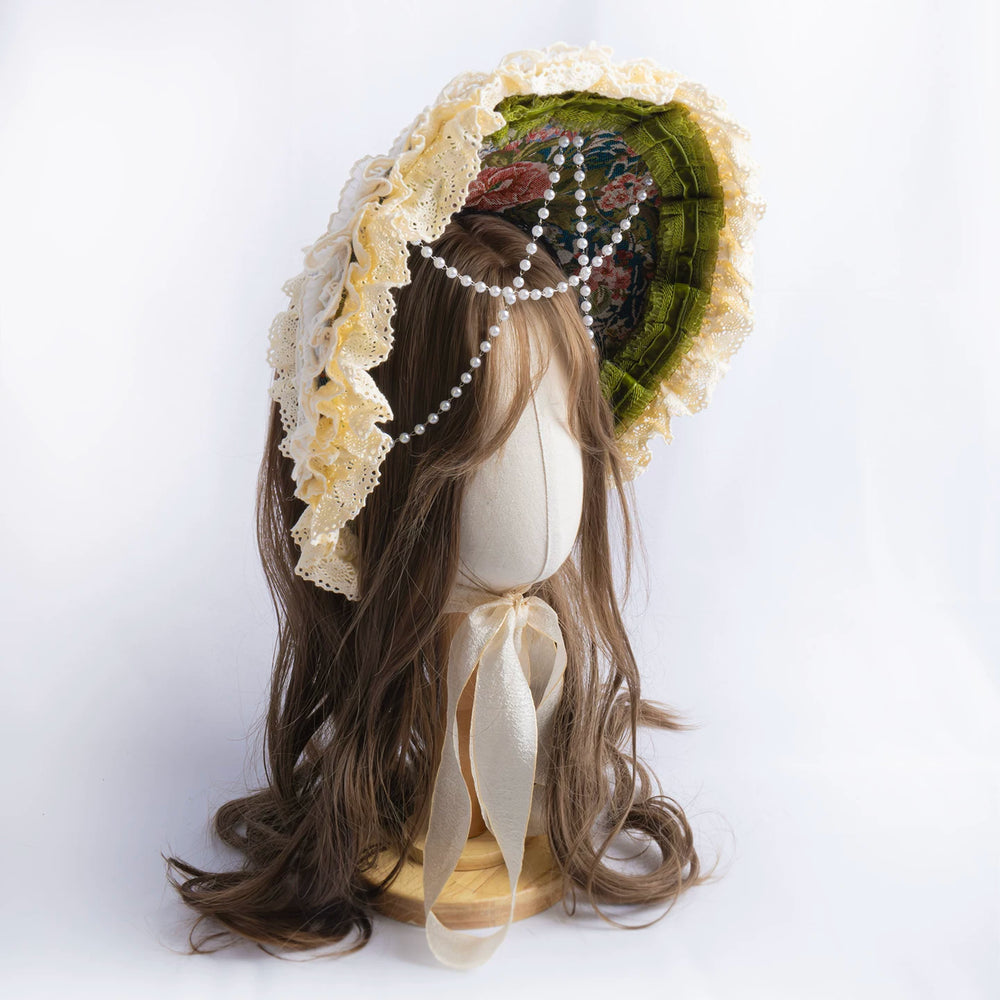 Lightbound Narrative lace-trimmed floral bonnet shown on a mannequin.