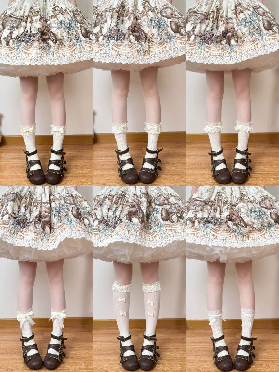 Chubby Bear Tales cream-yellow lace socks with bow trims styled beneath a printed skirt.