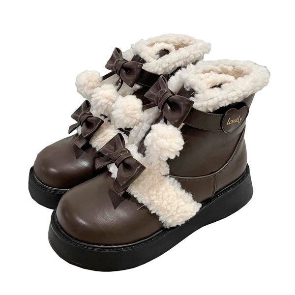 Brown short Lolita snow boots with fluffy lining, bows and pom-poms.