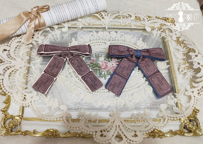Chocolate Daily Lolita Bow KC Brooch denim blue background chocolate bow tie