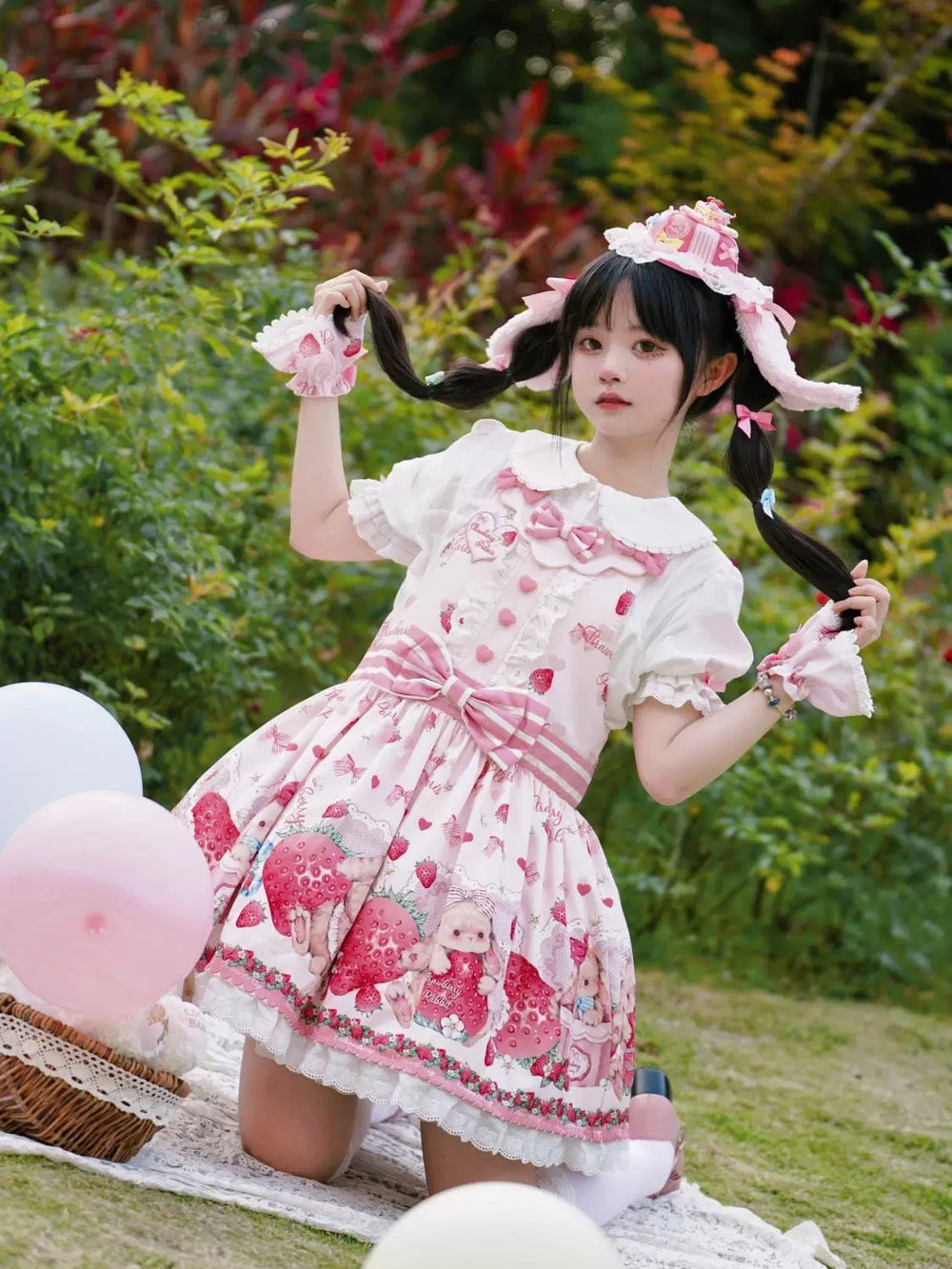 White short-sleeve blouse with a rounded lace collar and pink sleeve bows.