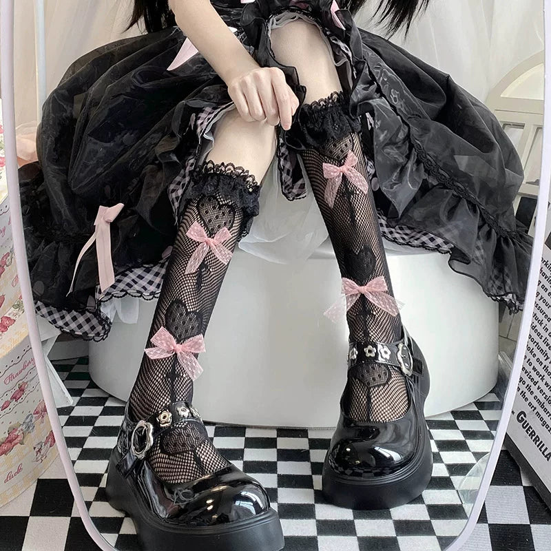 Lace-trimmed socks with pink bows and heart motifs in white or black