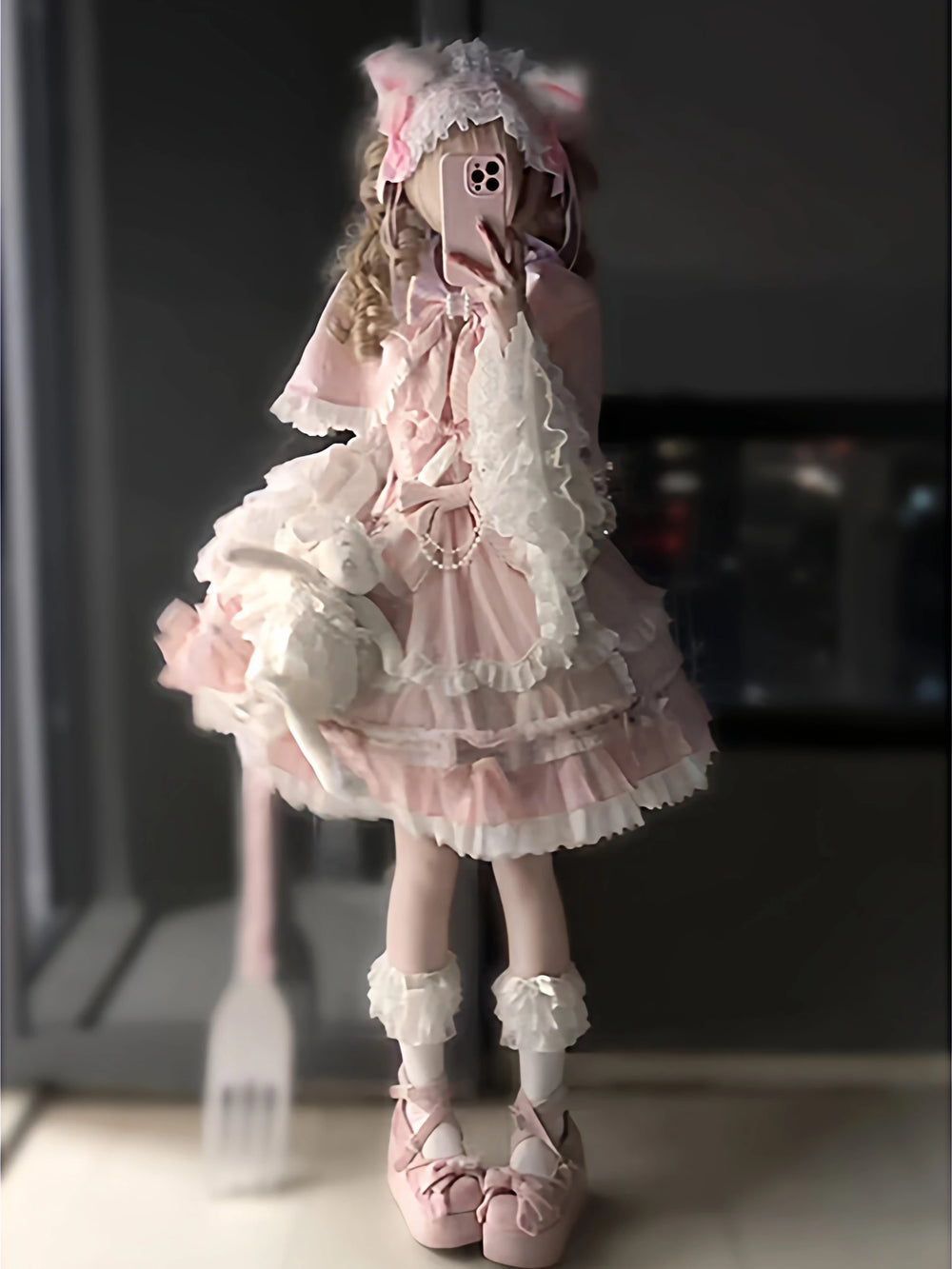 Pink-and-white Lolita outfit with lace cape, suspender dress and hime sleeves