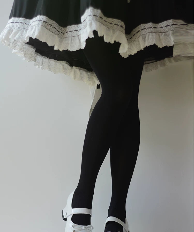 Black and white hosiery worn beneath lace-trimmed skirts