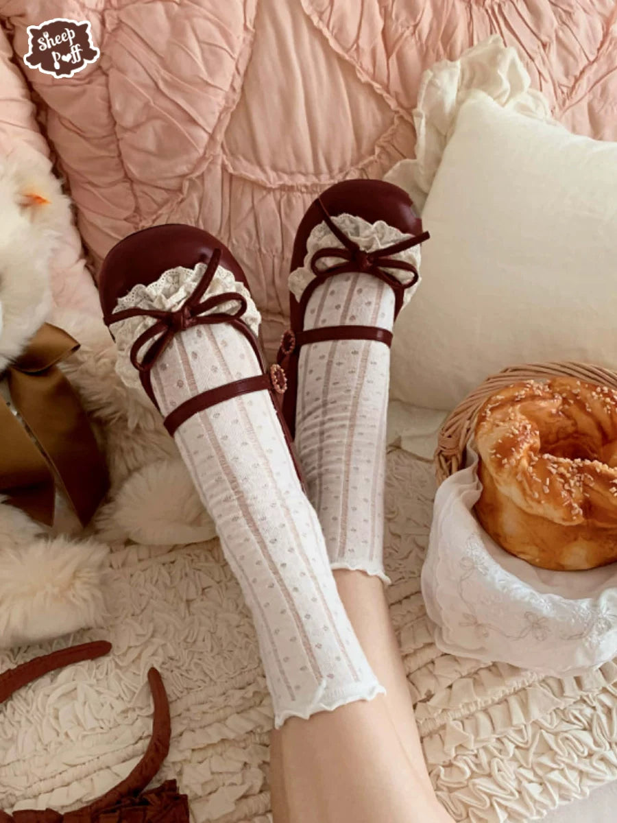 Sheep Puff Little Leila mid heel Lolita shoes in pastel pink with bow accents, featuring a cute and elegant design.
