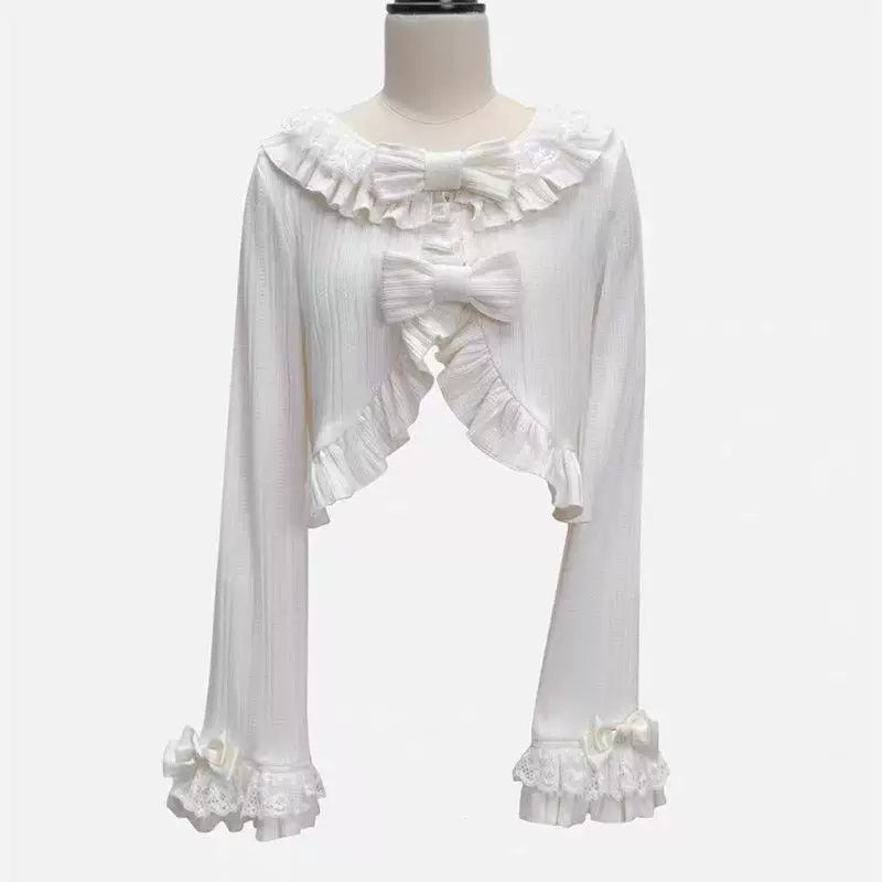 Sweetheart Dream Machine pink, white and blue lace-collar cardigans arranged flat