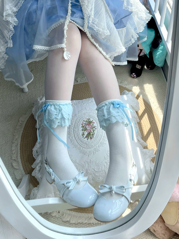 White and blue mid-calf socks with ruffled lace cuffs and blue bows
