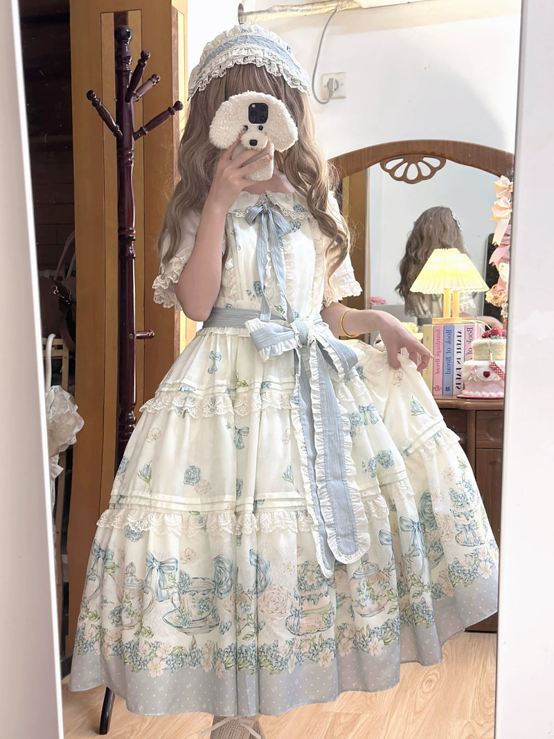 Tiered skirt detail showing polka-dot hem border and horizontal lace trim between tiers