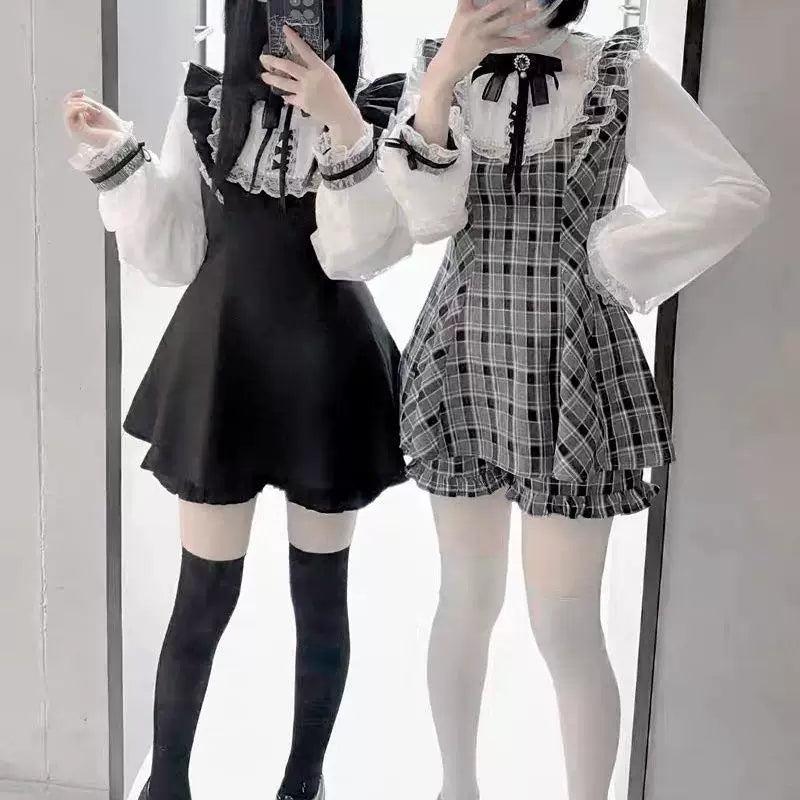 Black and gray long-sleeve Lolita sets displayed on mannequins.