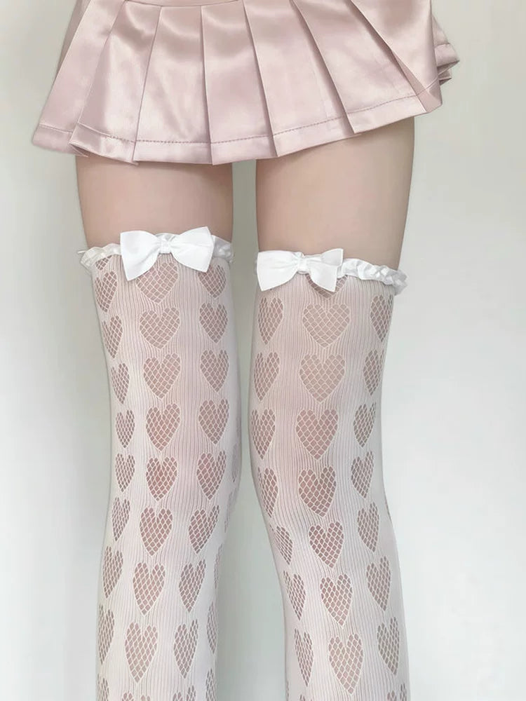 Close-up of heart pattern and bow detail on Lolita thigh-high socks