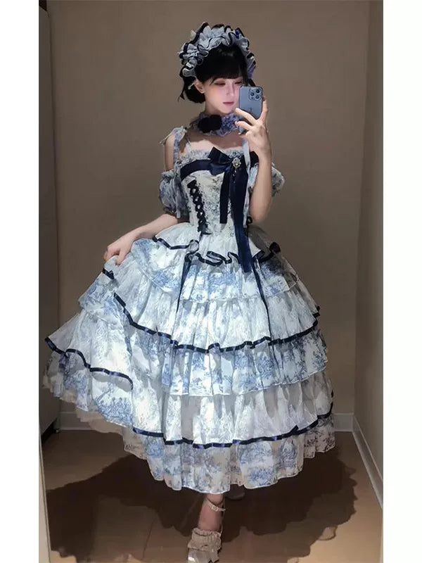Blue-and-white tiered Lolita OP dress with puff sleeves and a large navy bow.