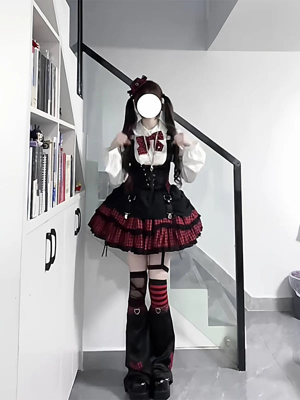 Black-and-red Lolita set with a white shirt, black vest and red plaid skirt