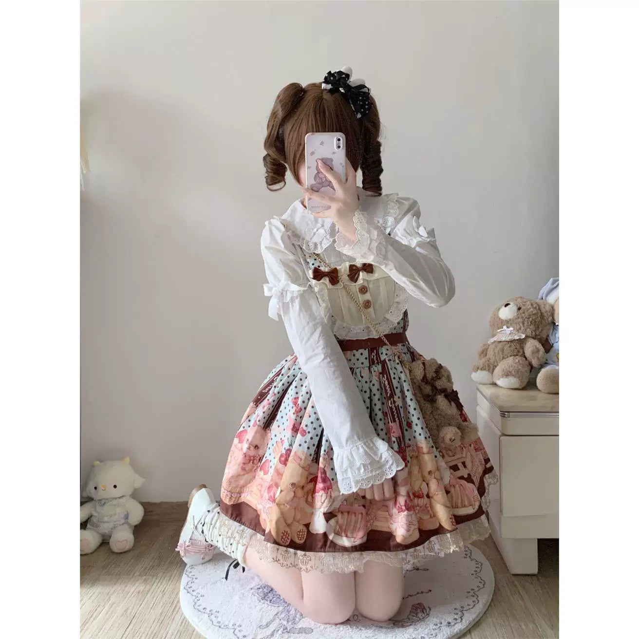 White Peter Pan collar blouse with gathered sleeves styled beneath a Lolita dress.